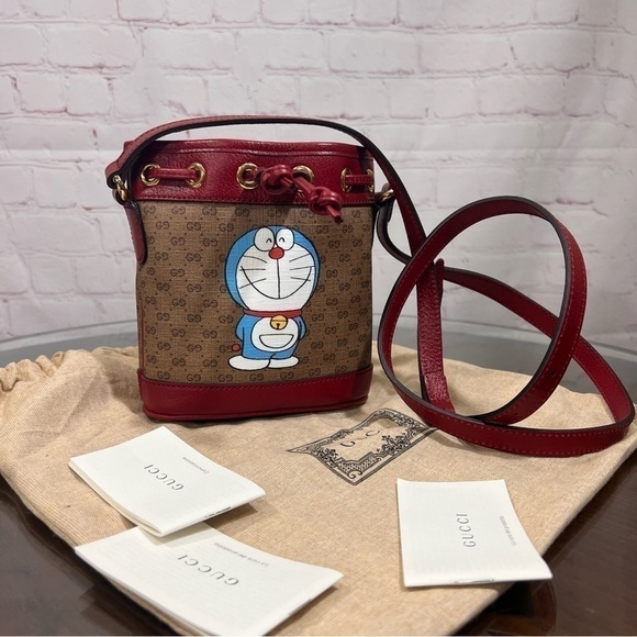 Gucci Handbags - GUCCI X DORAEMON Mini Vintage GG Supreme Monogram Bucket Bag Beige Cherry NEW